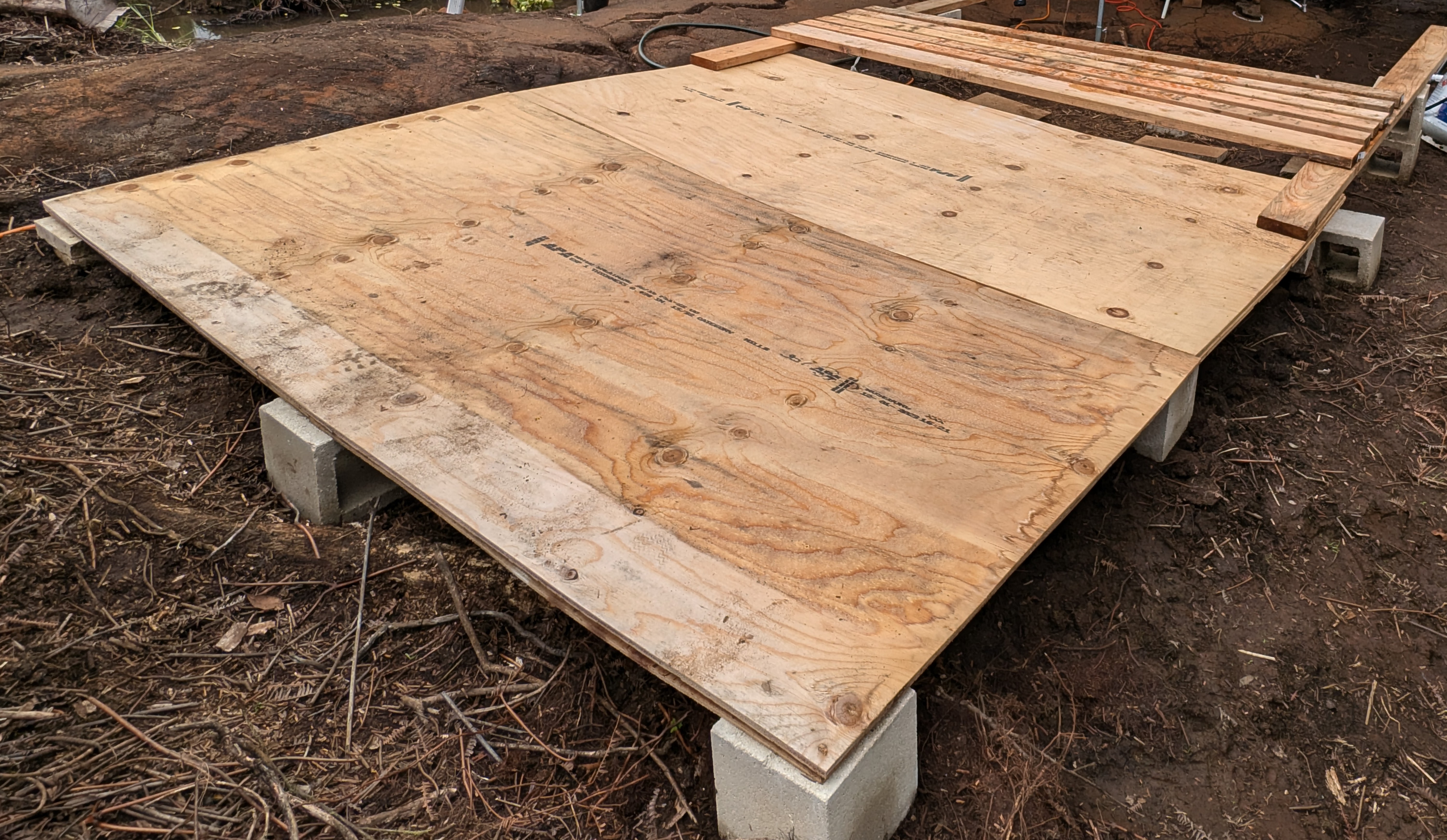 Plywood tent pad on cinder blocks