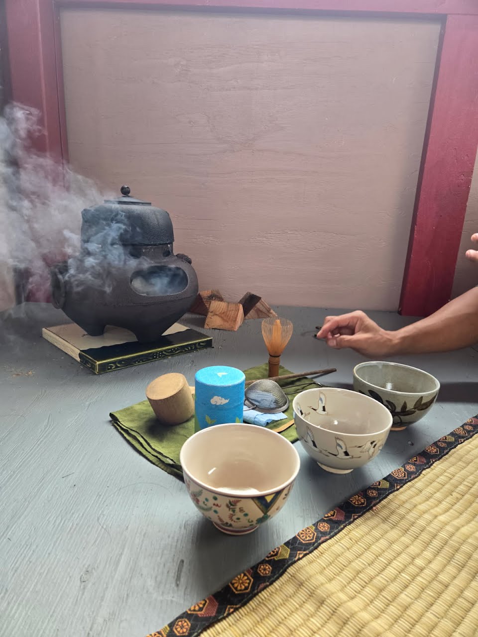Cast-iron chagama, matcha bowls, and a tea whisk